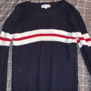 Navy blue sweater with white and red stripes